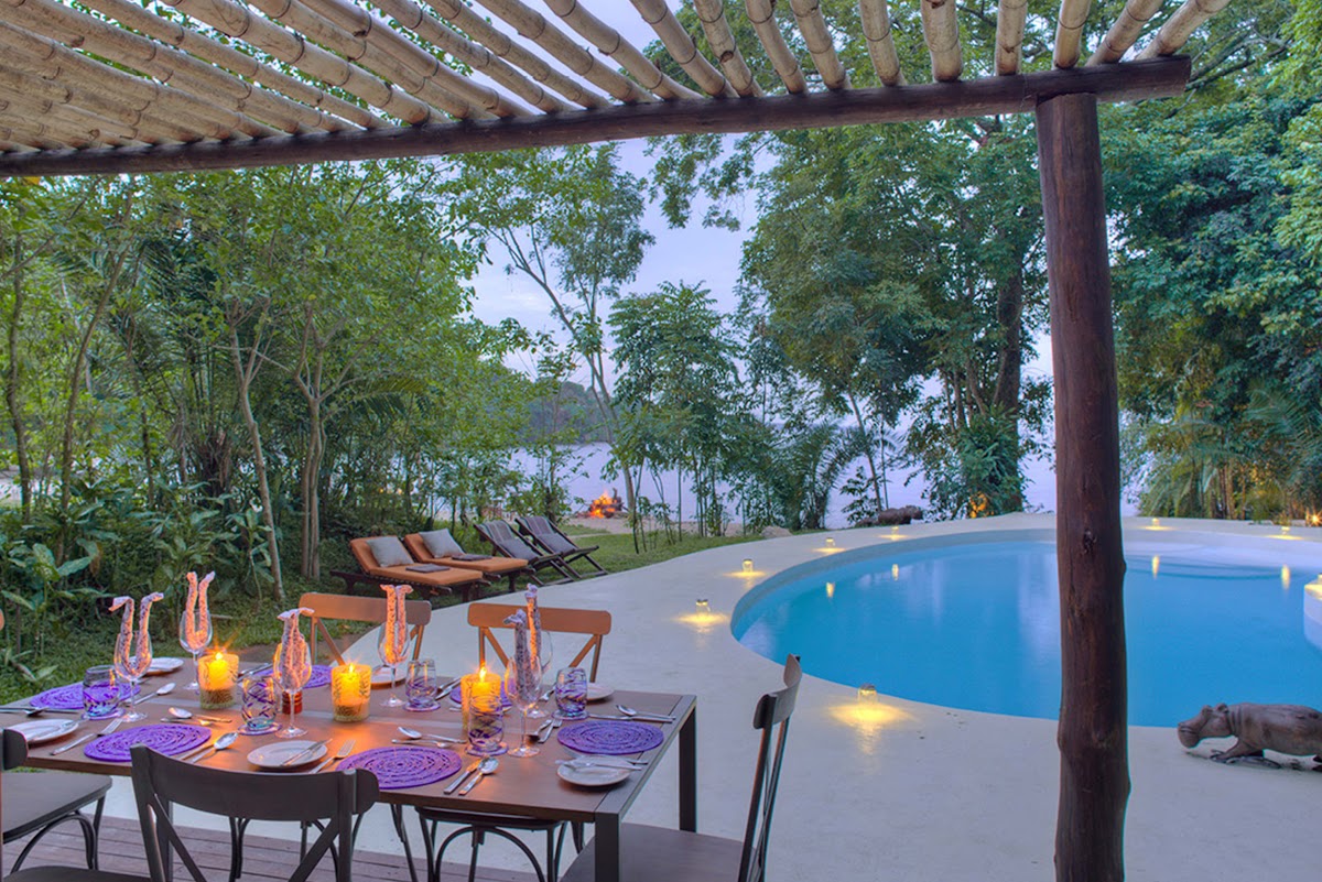 rubondo island camp private dining around the swimming pool